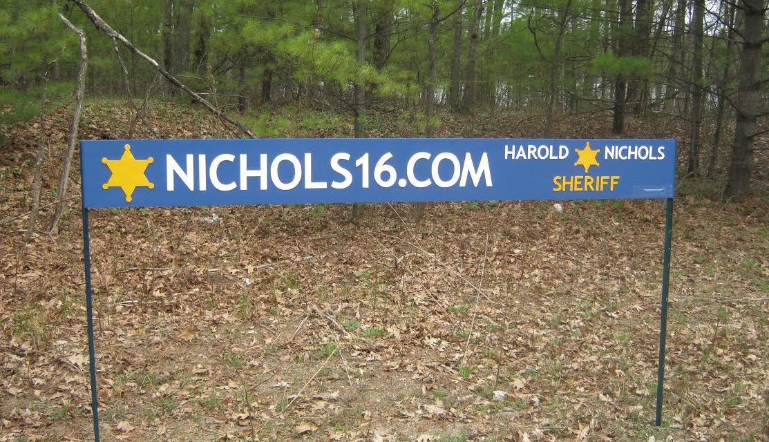 Candidate alters signs, is accused of tampering with evidence