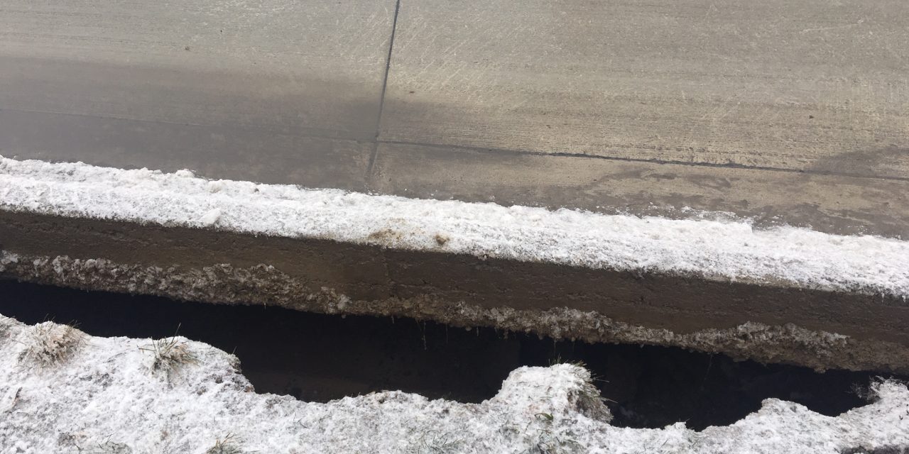 Gap under road found by the Fraser sinkhole site
